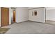 Open concept living room featuring carpet, view of hallway and eat-in kitchen at 5666 Ensley Ct, Indianapolis, IN 46254