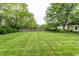 Spacious backyard with a well-maintained lawn and wooden fence at 5845 Arrowleaf Ln, Carmel, IN 46033