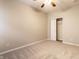 Neutral bedroom with carpeted floor, ceiling fan, and closet at 5845 Arrowleaf Ln, Carmel, IN 46033