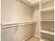 Walk-in closet with built-in shelving and carpeted floor at 5845 Arrowleaf Ln, Carmel, IN 46033