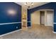 Bright dining room with wood floors leading into an open kitchen at 5845 Arrowleaf Ln, Carmel, IN 46033