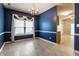 Inviting dining room with wood floors, chair railing, and modern chandelier at 5845 Arrowleaf Ln, Carmel, IN 46033