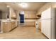 Bright kitchen featuring light wood cabinets, white appliances, and an open layout ideal for cooking and entertaining at 5845 Arrowleaf Ln, Carmel, IN 46033