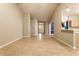 Expansive living area with hardwood floors flowing seamlessly to an open kitchen, creating a perfect entertaining space at 5845 Arrowleaf Ln, Carmel, IN 46033
