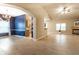 Open-concept living area with hardwood floors, a fireplace, and seamless flow to the kitchen and dining spaces at 5845 Arrowleaf Ln, Carmel, IN 46033