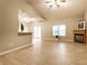 Spacious living area featuring hardwood floors, a cozy fireplace, and ample natural light, perfect for relaxation at 5845 Arrowleaf Ln, Carmel, IN 46033