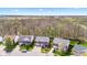An aerial view of a residential neighborhood with beautiful homes and well-kept lawns next to a wooded area at 5924 Skyward Ln, Indianapolis, IN 46234