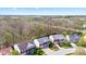 An aerial view of a residential neighborhood with beautiful homes and well-kept lawns next to a wooded area at 5924 Skyward Ln, Indianapolis, IN 46234