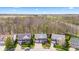 An aerial view of a residential neighborhood with beautiful homes and well-kept lawns next to a wooded area at 5924 Skyward Ln, Indianapolis, IN 46234