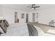 Inviting bedroom with plush carpeting, an updated ceiling fan, and large windows, creating a relaxing atmosphere at 5924 Skyward Ln, Indianapolis, IN 46234