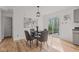 Dining area with modern table set and sliding glass door to the backyard at 5924 Skyward Ln, Indianapolis, IN 46234