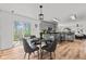 Dining area with modern table set and sliding glass door providing a view at 5924 Skyward Ln, Indianapolis, IN 46234