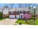 Charming two-story brick home with a well-manicured lawn and a two car garage at 5924 Skyward Ln, Indianapolis, IN 46234