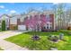 Beautiful two-story home with a brick facade, a lovely flowering tree, and a well-manicured front lawn at 5924 Skyward Ln, Indianapolis, IN 46234