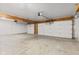 Spacious two car garage with exposed beam construction and an abundance of space for parking and storage at 5924 Skyward Ln, Indianapolis, IN 46234