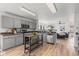 An open concept kitchen featuring gray cabinets, stainless steel appliances, and a mobile island at 5924 Skyward Ln, Indianapolis, IN 46234