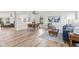 Bright open-concept living and dining area featuring modern furnishings and lots of natural light at 5924 Skyward Ln, Indianapolis, IN 46234