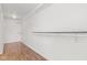 Spacious walk-in closet with wood-look flooring and multiple levels of shelving at 5924 Skyward Ln, Indianapolis, IN 46234