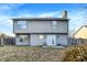 Spacious backyard featuring a gray-sided home with a patio and fenced yard at 5937 Terrytown Pkwy, Indianapolis, IN 46254