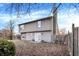 Spacious backyard featuring a gray-sided home with a patio and fenced yard at 5937 Terrytown Pkwy, Indianapolis, IN 46254
