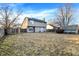 Spacious backyard featuring a well-maintained lawn, tall trees, and a fenced perimeter at 5937 Terrytown Pkwy, Indianapolis, IN 46254