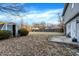 The backyard features a lush lawn, shed, concrete patio area, and perimeter fence at 5937 Terrytown Pkwy, Indianapolis, IN 46254