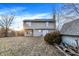 View of the backyard with an open space, shed and the exterior of the home at 5937 Terrytown Pkwy, Indianapolis, IN 46254