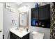 The bathroom showcases a sink with a mirror and a cabinet at 5937 Terrytown Pkwy, Indianapolis, IN 46254