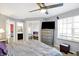 The bedroom features a bed with a TV and gray walls at 5937 Terrytown Pkwy, Indianapolis, IN 46254