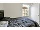 Bedroom featuring a dark headboard and window at 5937 Terrytown Pkwy, Indianapolis, IN 46254