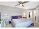 The bedroom showcases a bed with a ceiling fan and carpet at 5937 Terrytown Pkwy, Indianapolis, IN 46254