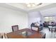 Dining area view with laminate floors and room for table and chairs at 5937 Terrytown Pkwy, Indianapolis, IN 46254