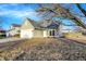 Beautiful home with a lush front lawn, mature trees, and attractive curb appeal at 5937 Terrytown Pkwy, Indianapolis, IN 46254