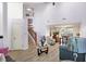 Bright and airy living room with a soaring ceiling and views of the dining area at 5937 Terrytown Pkwy, Indianapolis, IN 46254