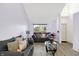 Inviting living room with vaulted ceilings, laminate flooring, and plenty of natural light at 5937 Terrytown Pkwy, Indianapolis, IN 46254