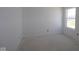 A well lit bedroom with natural lighting and bare walls offering a blank canvas for personalization at 6120 Paperbark Way, Indianapolis, IN 46259
