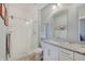 Modern bathroom with granite counters, white cabinetry, and a glass shower enclosure at 620 Pomeroy St, Indianapolis, IN 46202