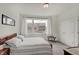 Cozy bedroom with large window, stylish furniture, and neutral tones, creating a peaceful retreat at 620 Pomeroy St, Indianapolis, IN 46202