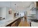 Open concept kitchen with a center island, stainless steel appliances and hardwood floors at 620 Pomeroy St, Indianapolis, IN 46202