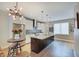 A modern kitchen features granite countertops, stainless steel appliances, and designer lighting at 620 Pomeroy St, Indianapolis, IN 46202
