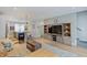 Spacious living area with rustic media center, a stylish couch, and modern kitchen island at 620 Pomeroy St, Indianapolis, IN 46202