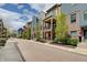 A row of townhomes showcase their unique facades and well-kept landscaping along a brick paved street at 620 Pomeroy St, Indianapolis, IN 46202