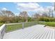 Large back deck with painted railings overlooking the serene backyard at 6507 Tram Ct, Indianapolis, IN 46260