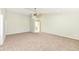 Spacious room features neutral walls, carpeting, a ceiling fan, offering a versatile space for any lifestyle at 6507 Tram Ct, Indianapolis, IN 46260