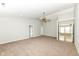 Bright and airy room with neutral walls, carpeting, a ceiling fan, and multiple entryways on the second floor at 6507 Tram Ct, Indianapolis, IN 46260