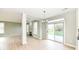 Bright dining area with a fireplace and sliding glass doors leading to the deck at 6507 Tram Ct, Indianapolis, IN 46260