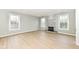 Spacious living room features a decorative fireplace and ample natural light at 6507 Tram Ct, Indianapolis, IN 46260