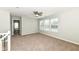 Carpeted loft area with a ceiling fan and multiple windows at 6507 Tram Ct, Indianapolis, IN 46260