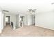 Spacious loft features neutral walls, neutral carpet, ceiling fan, and access to multiple rooms on the second floor at 6507 Tram Ct, Indianapolis, IN 46260
