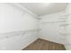 Bright walk-in closet with plenty of space and built-in wire shelving on all sides at 6507 Tram Ct, Indianapolis, IN 46260